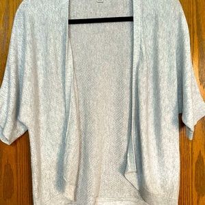 A New Day Short Sleeve Crop Cardigan. Metallic silver in color.